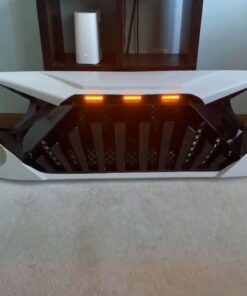 an aftermarket goliath grille designed for the jeep wrangler jl and gladiator jt models.