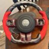 custom carbon fiber and red suede steering wheel for a jeep wrangler
