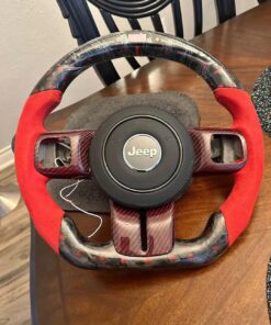 custom carbon fiber and red suede steering wheel for a jeep wrangler